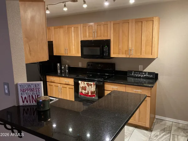 a kitchen with granite countertop lots of counter top space