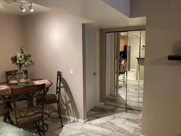a view of a hallway with furniture and front door