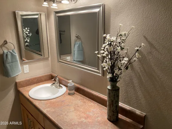 a bathroom with a sink and mirror