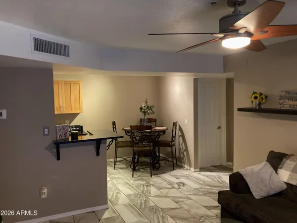 a dining room with furniture and window