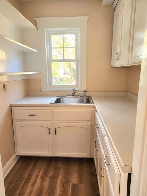 25 Glendower Road, Unit 2 Boston, MA 02131 - Photo 8 of 17 a room with a sink cabinets and a window