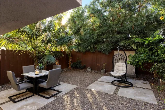 a view of a chairs and tables in the patio