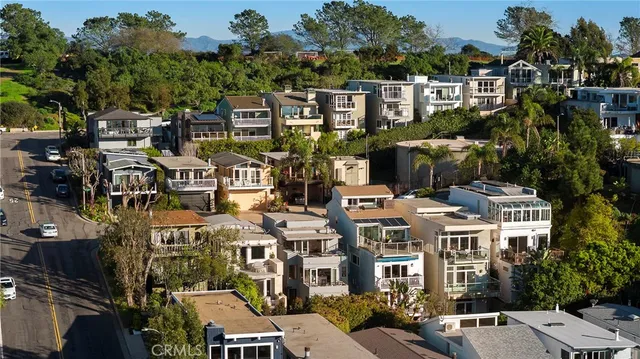 a living room with furniture fireplace and a large window
