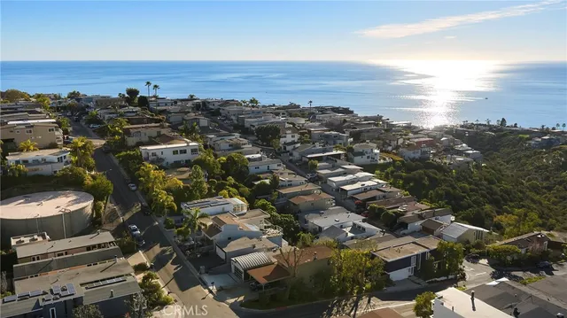 an aerial view of residential houses and outdoor space