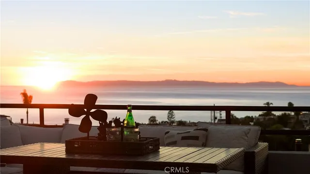 a view of a balcony with an outdoor seating