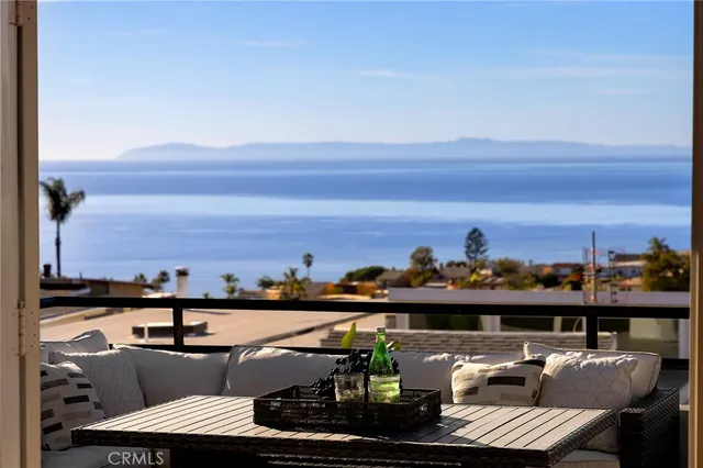 a view of a bedroom with furniture and a potted plant