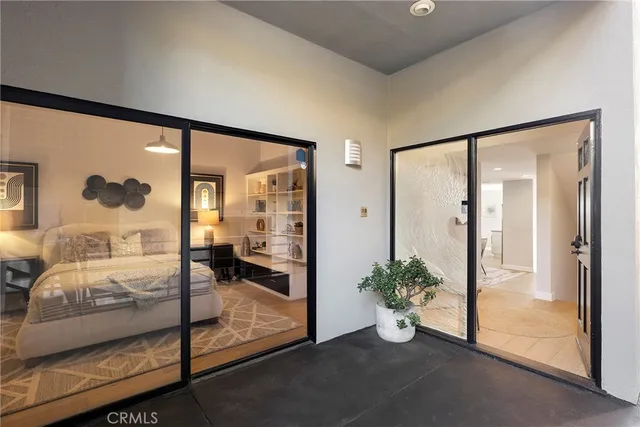 a view of a hallway with bathroom