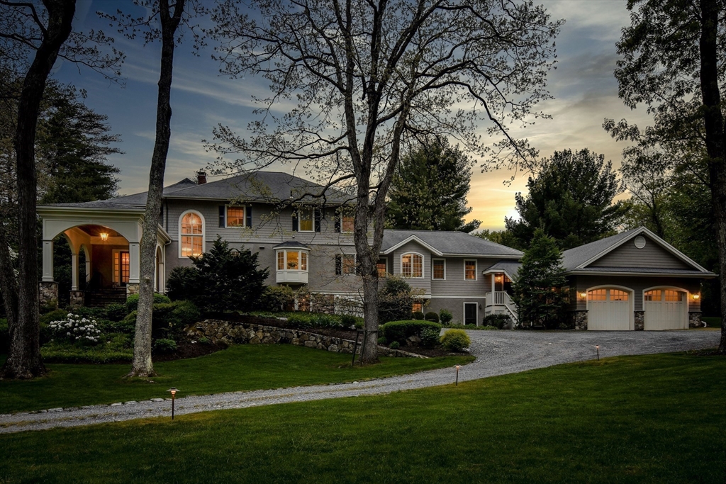134 Dedham Street Dover, MA 02030 - Photo 2 of 42 a front view of a house with a yard
