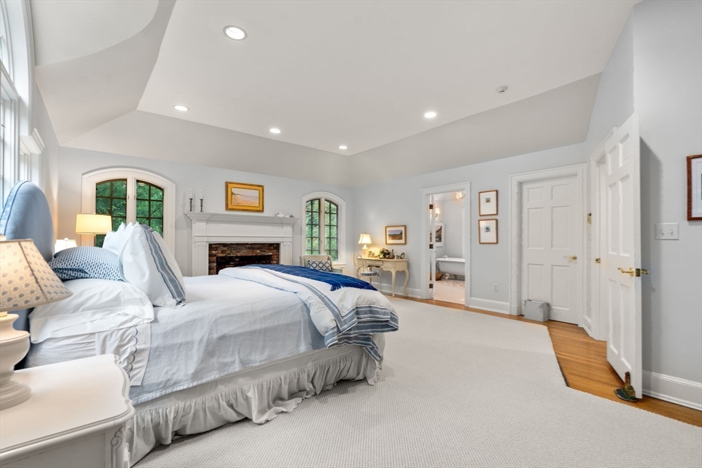 134 Dedham Street Dover, MA 02030 - Photo 21 of 42 a spacious bedroom with a large bed and furniture