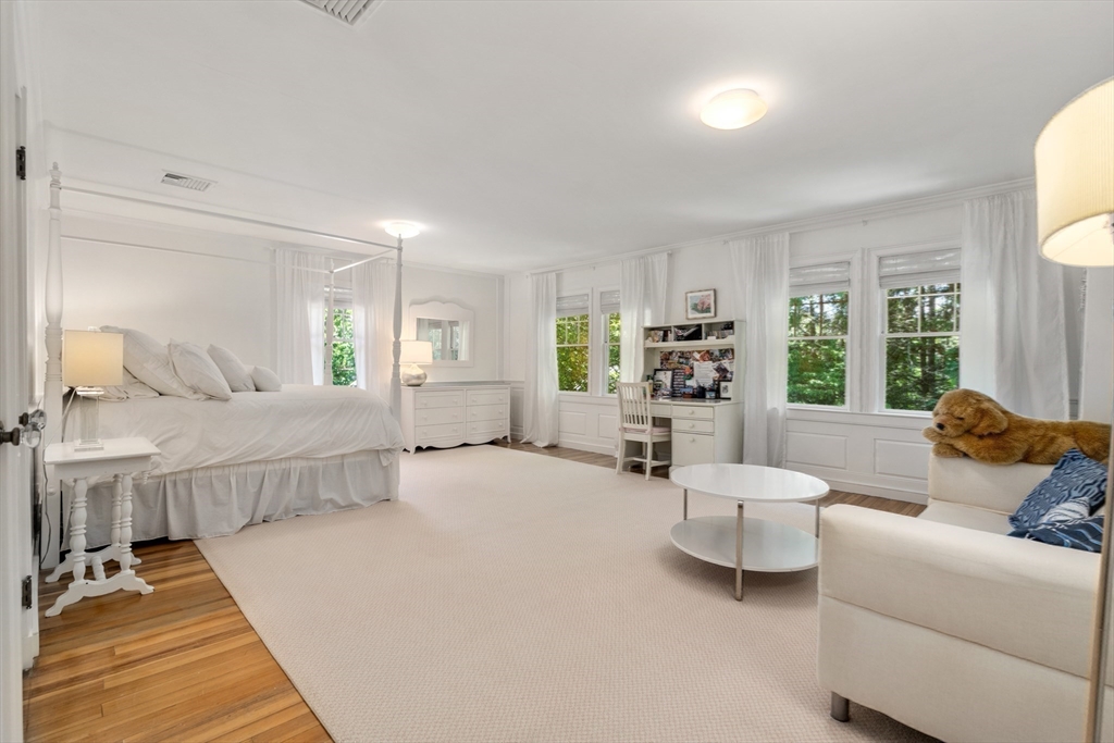134 Dedham Street Dover, MA 02030 - Photo 23 of 42 a bedroom with furniture and a large window