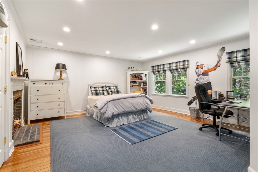 134 Dedham Street Dover, MA 02030 - Photo 24 of 42 a spacious bedroom with a large bed and a desk