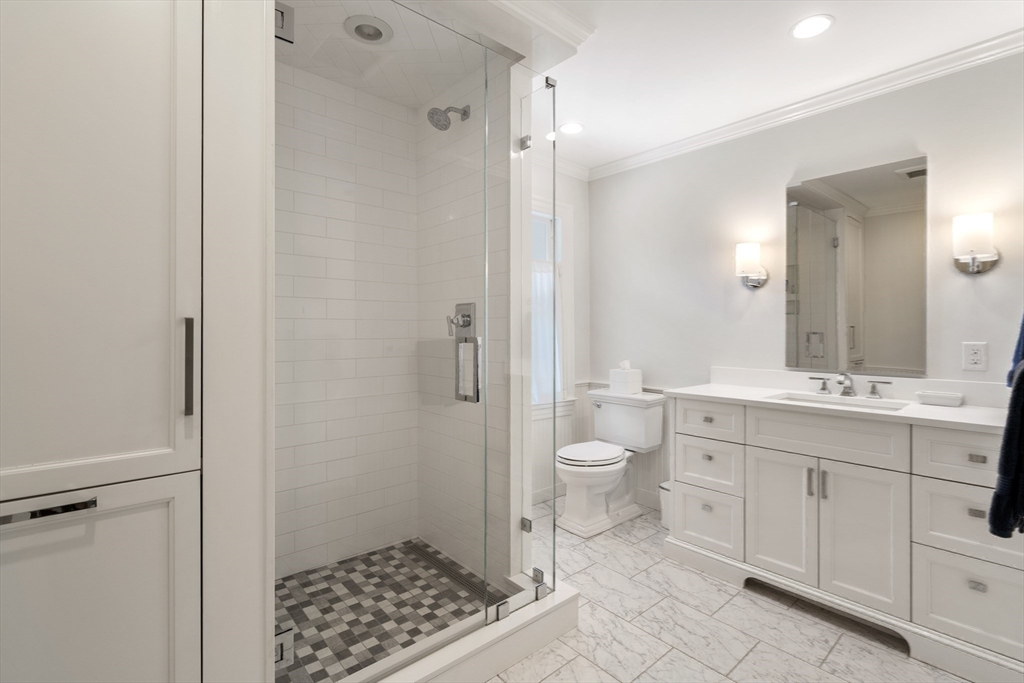 134 Dedham Street Dover, MA 02030 - Photo 25 of 42 a bathroom with a sink a toilet and shower