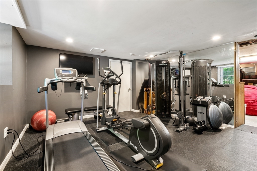 134 Dedham Street Dover, MA 02030 - Photo 28 of 42 a view of a room with gym equipment