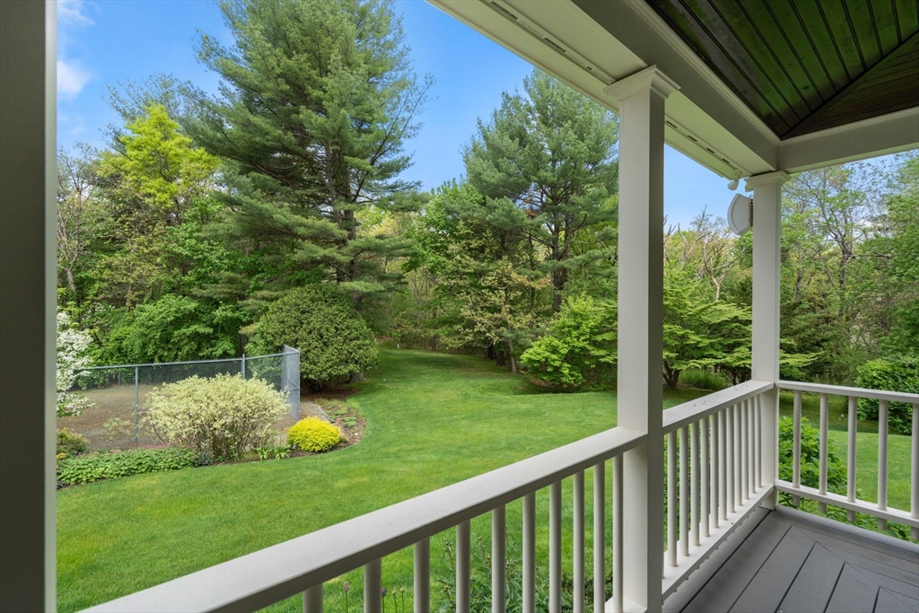 134 Dedham Street Dover, MA 02030 - Photo 30 of 42 a view of a chair and table in the deck