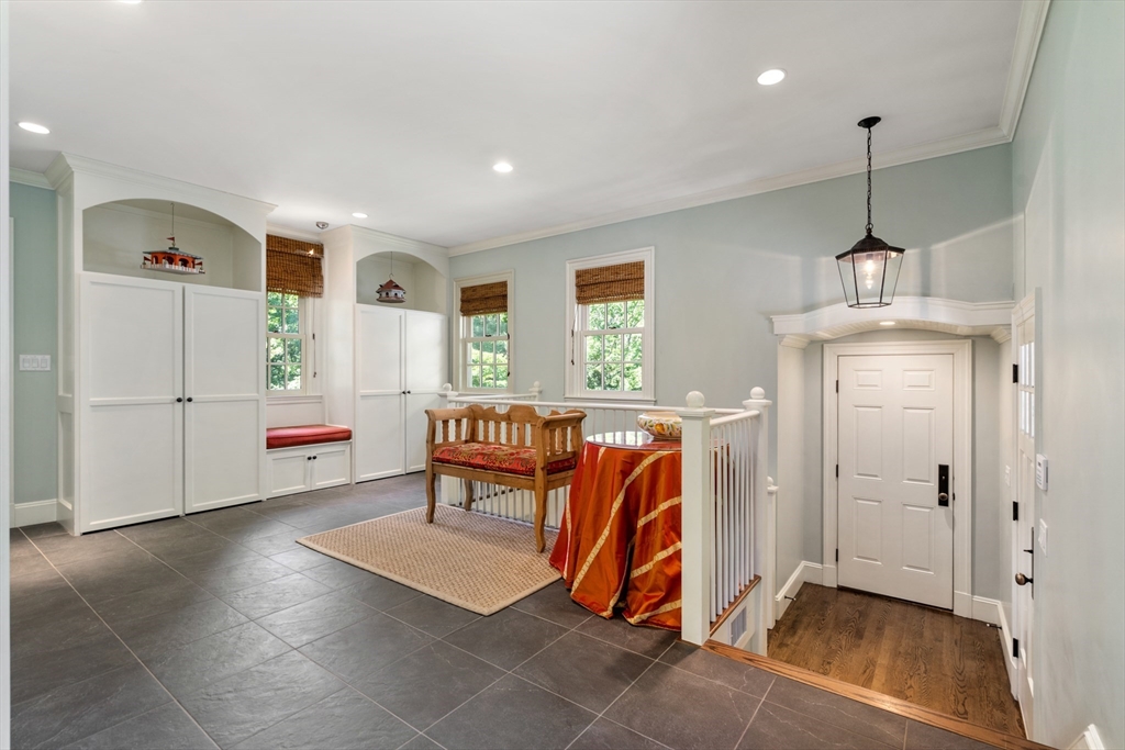 134 Dedham Street Dover, MA 02030 - Photo 31 of 42 a view of a livingroom with furniture and a ceiling fan