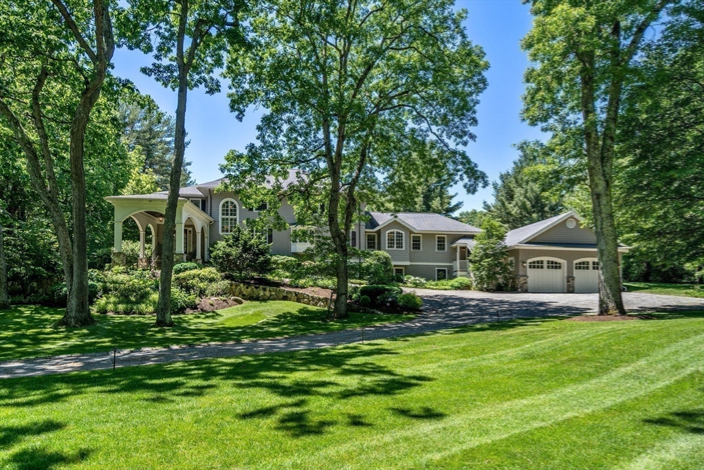 134 Dedham Street Dover, MA 02030 - Photo 37 of 42 a view of a house with a big yard potted plants and large tree