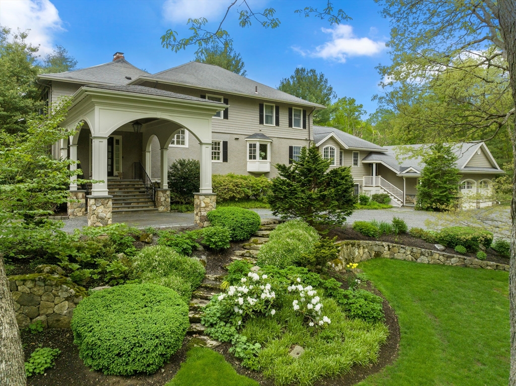 134 Dedham Street Dover, MA 02030 - Photo 42 of 42 a front view of a house with a garden