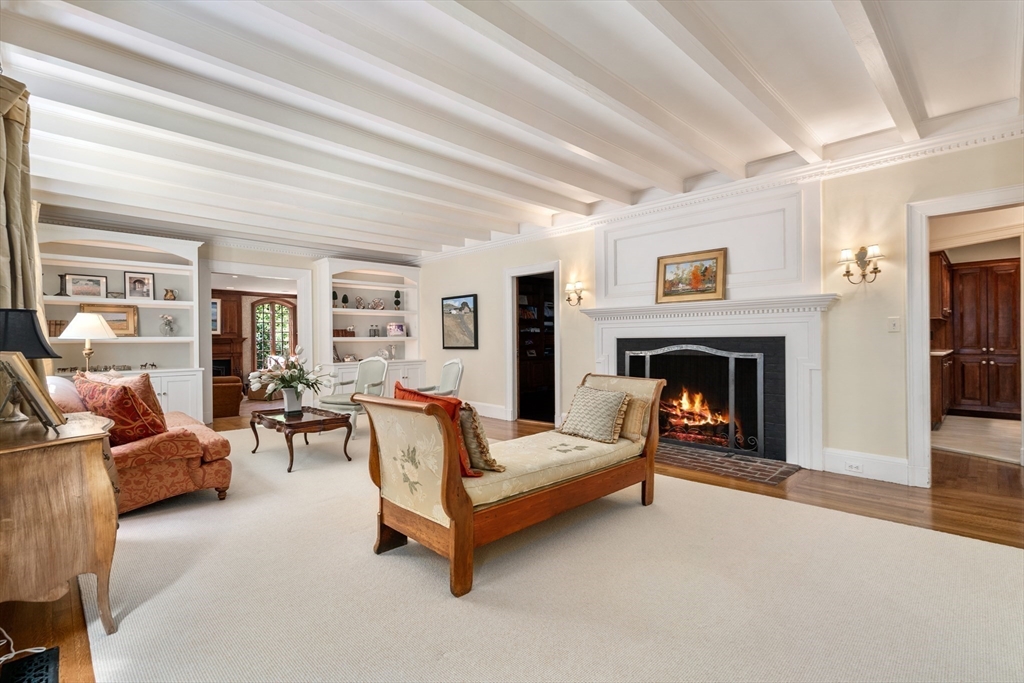 134 Dedham Street Dover, MA 02030 - Photo 7 of 42 a living room with furniture and a fireplace