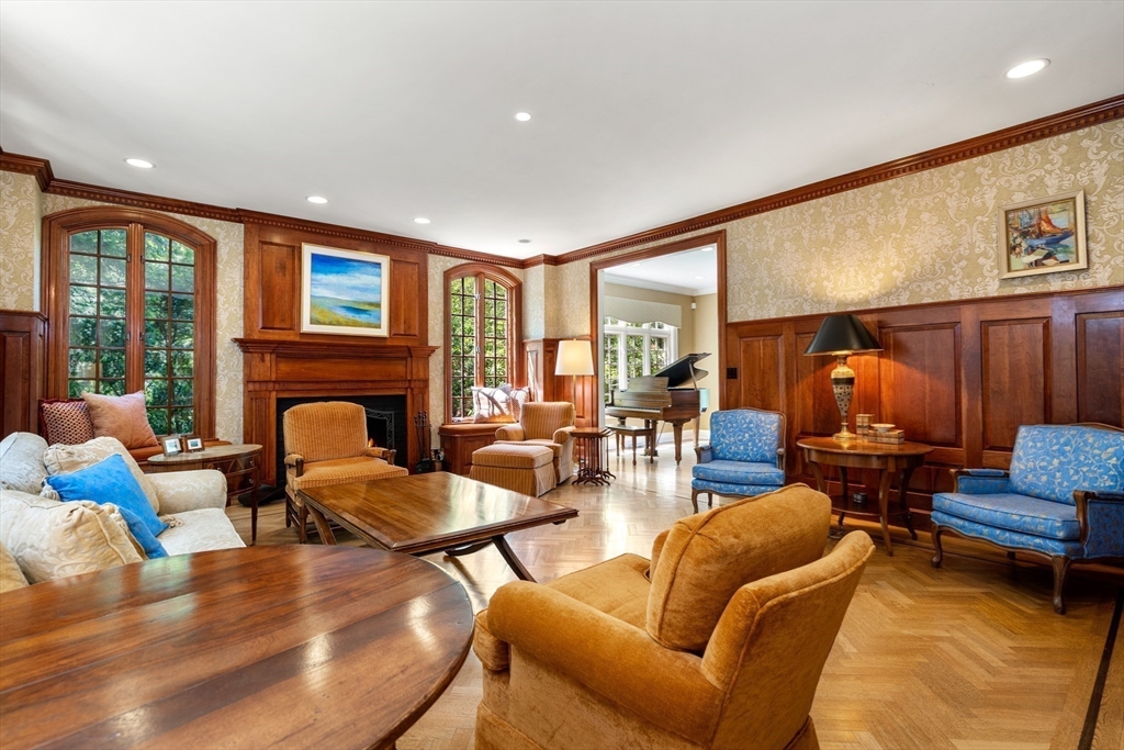134 Dedham Street Dover, MA 02030 - Photo 9 of 42 a living room with furniture fireplace and a large window