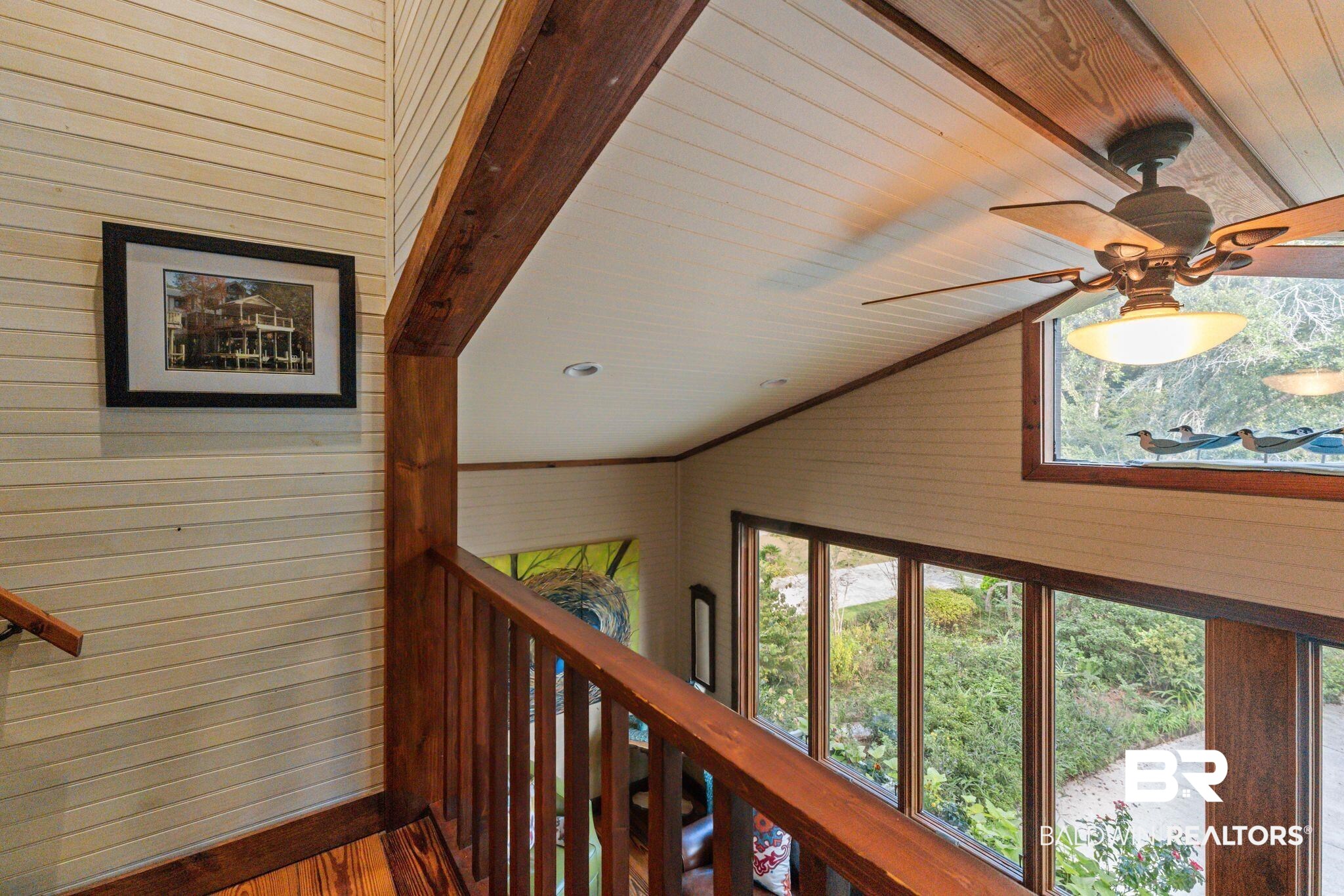16451 Honey Road Summerdale, AL 36580 - Photo 29 of 55 Corridor featuring wooden walls and wood finished floors