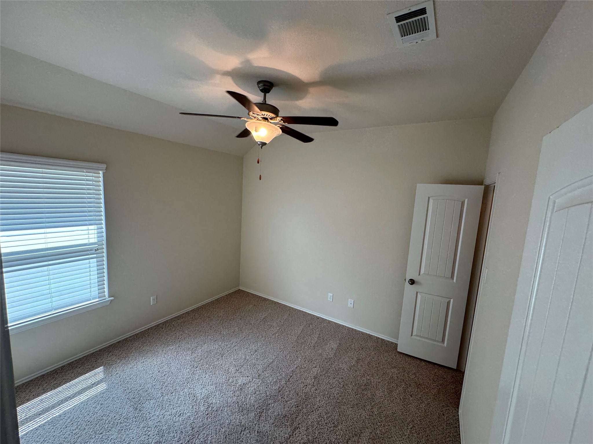 112 Eagle Owl Loop Leander, TX 78641 - Photo 17 of 34 Carpeted room with a ceiling fan light fixture