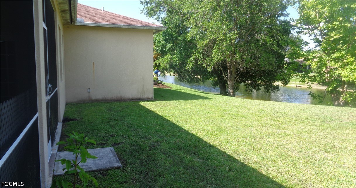 2463 Nature Pointe Loop Fort Myers, FL 33905 - Photo 44 of 50 a view of a backyard with a garden