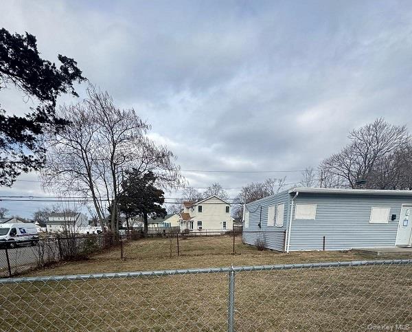 20 North Somerset Road Amityville, NY 11701 - Photo 2 of 5 View of fenced yard