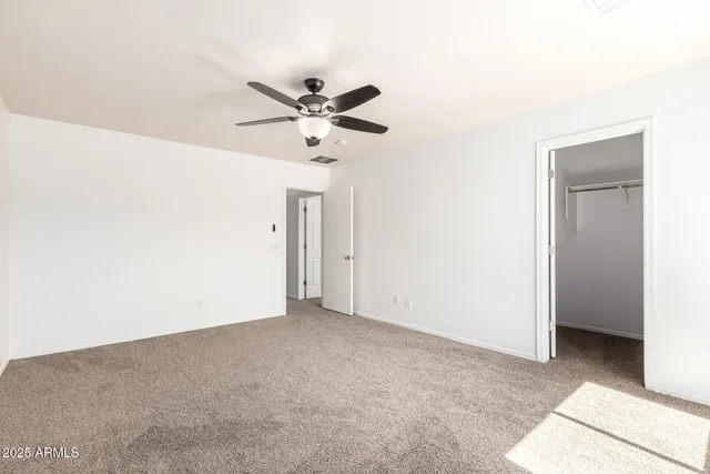 a view of a big room with carpet