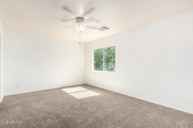 a bathroom with a sink a toilet and a large mirror