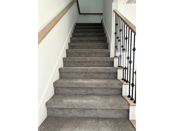 a view of a hallway with seating area
