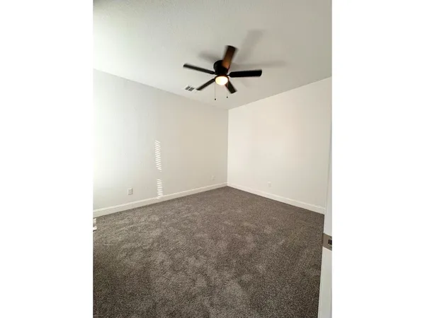 a view of a hallway with a white walls