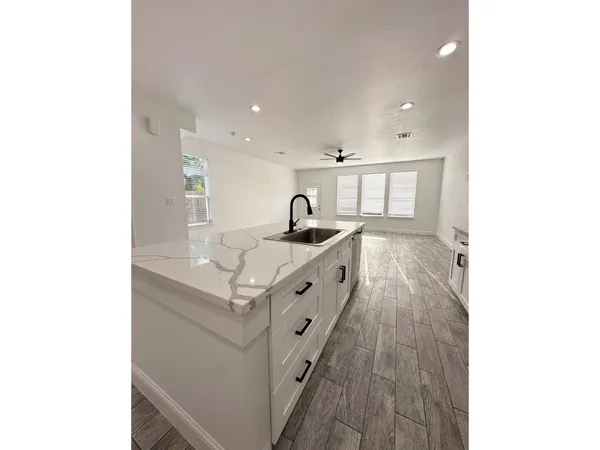 a room with a bench and cabinets