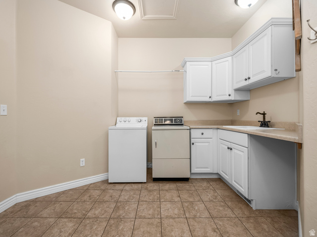 255 East 1200 North Mapleton, UT 84664 - Photo 33 of 37 Utility room featuring tile flooring, white cabinetry, a built-in sink, and a clothes rod