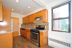 142 Garth Road, Unit 5N Scarsdale, NY 10583 - Photo 1 of 1 New Eat-in-Kitchen with stainless steel appliances, Granite counters, glass tile back splash and recess lighting. The eat-in-kitchen is 14'-6 x 7'-10".