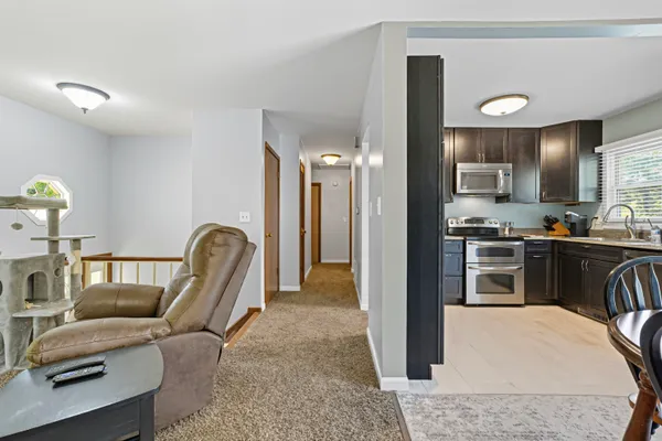 a kitchen with a refrigerator and a sink