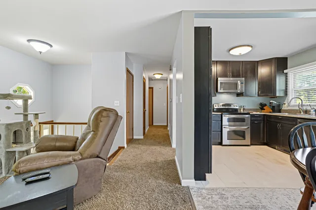 a kitchen with a refrigerator and a sink