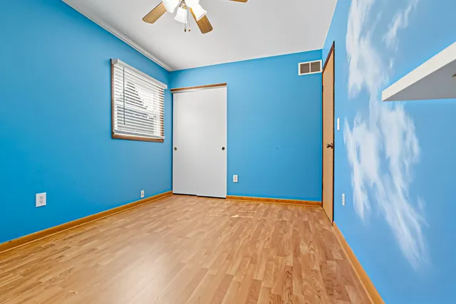 a view of a big room with closet and a window