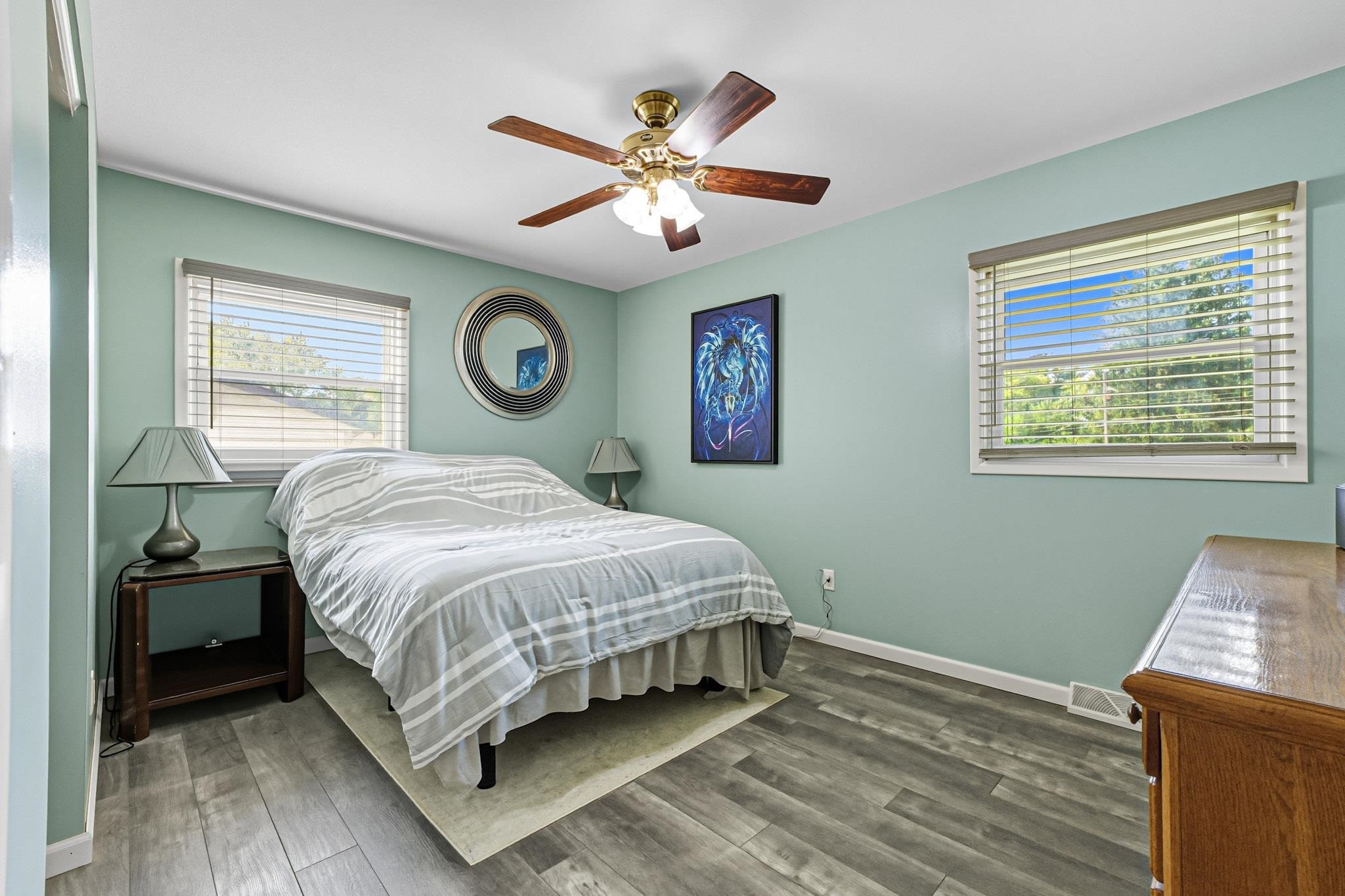 2124 West Middlebury Road Freeport, IL 61032 - Photo 15 of 23 a bedroom with a large bed and a chandelier