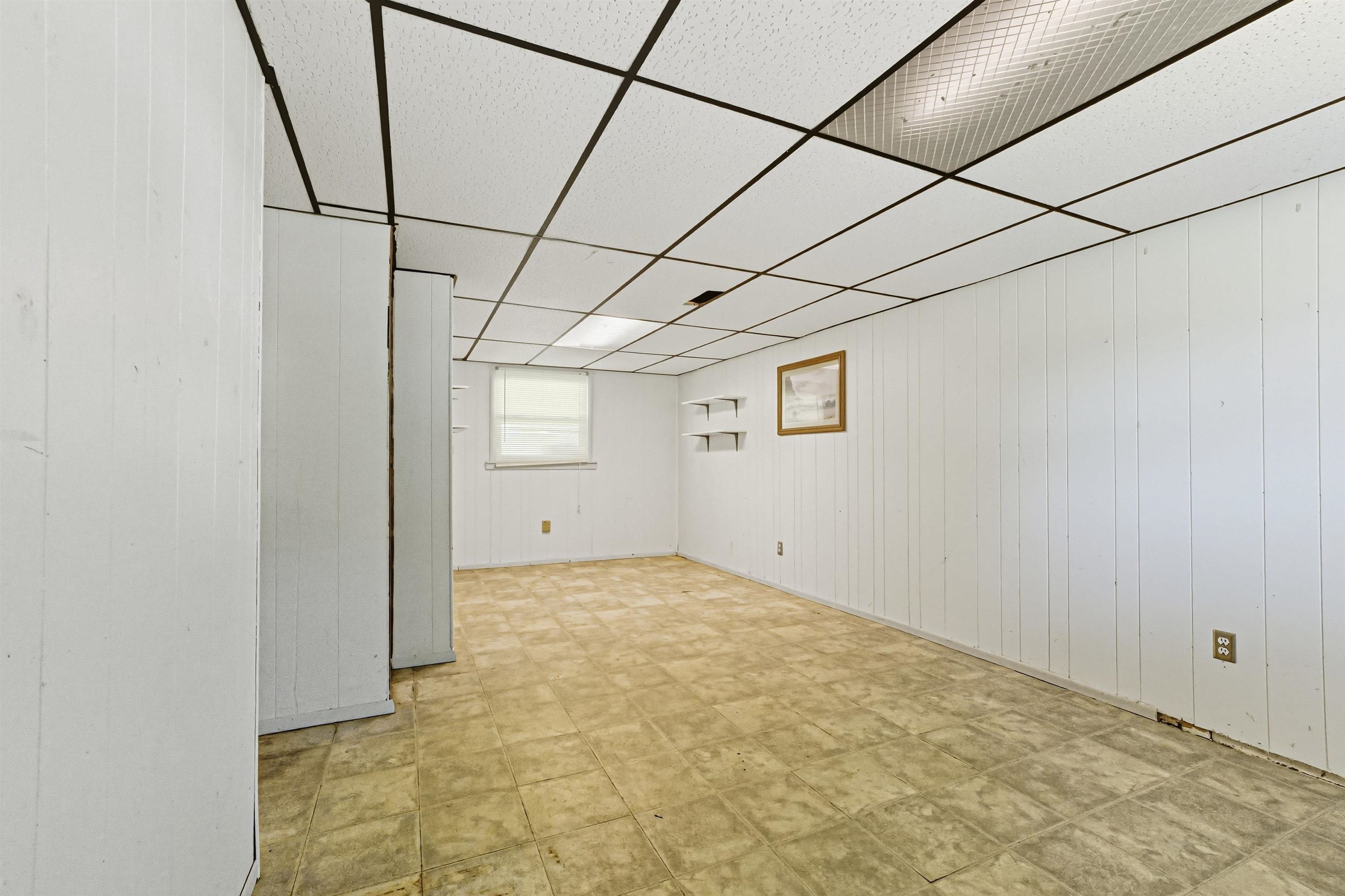 2124 West Middlebury Road Freeport, IL 61032 - Photo 15 of 23 a view of a room with a white bed and wooden floor
