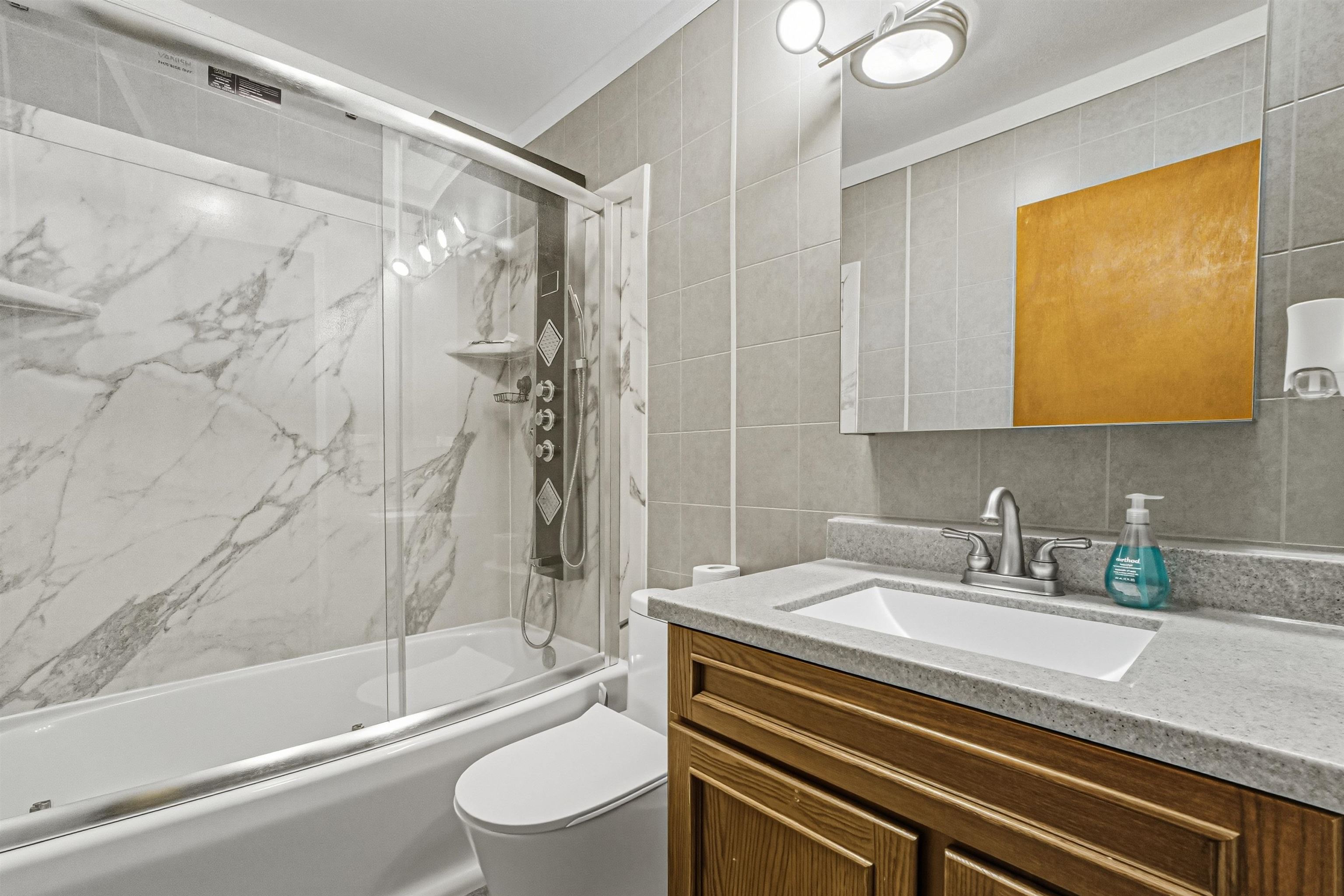 2124 West Middlebury Road Freeport, IL 61032 - Photo 17 of 23 a bathroom with a sink a toilet and a bathtub
