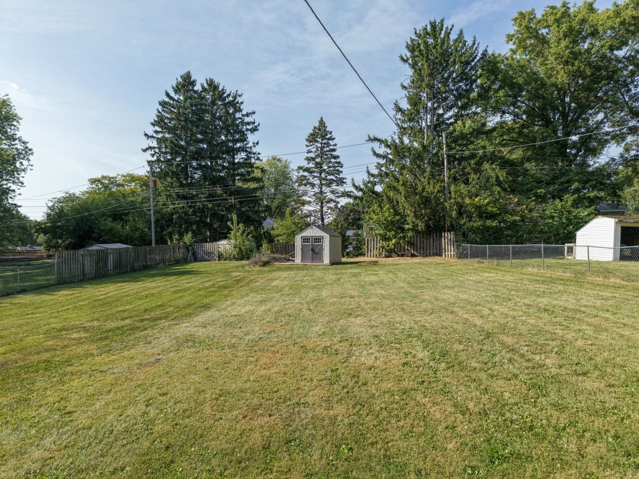 2124 West Middlebury Road Freeport, IL 61032 - Photo 20 of 23 a front view of a house with a yard and trees