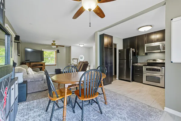 a dining room with furniture and window