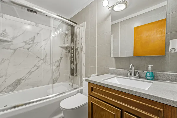 a bathroom with a sink a toilet and a bathtub