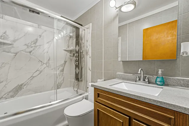 a bathroom with a sink a toilet and a bathtub