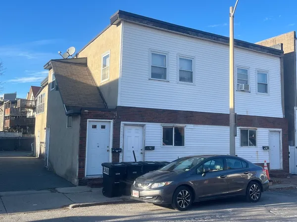 a car parked in front of a house