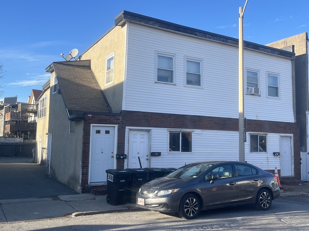 43 Cross Street Somerville, MA 02145 - Photo 1 of 7 a car parked in front of a house