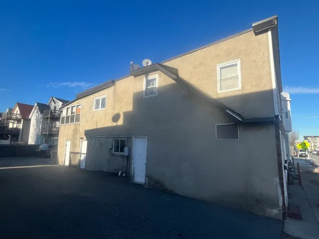 a view of a house with a street