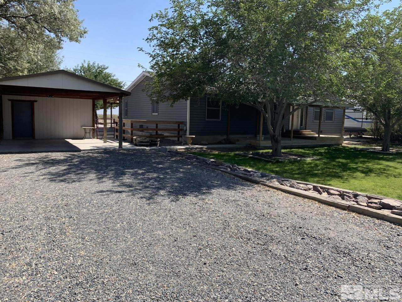 450 Reservoir Road Lovelock, NV 89419 - Photo 1 of 37 a view of a house with a yard and tree s