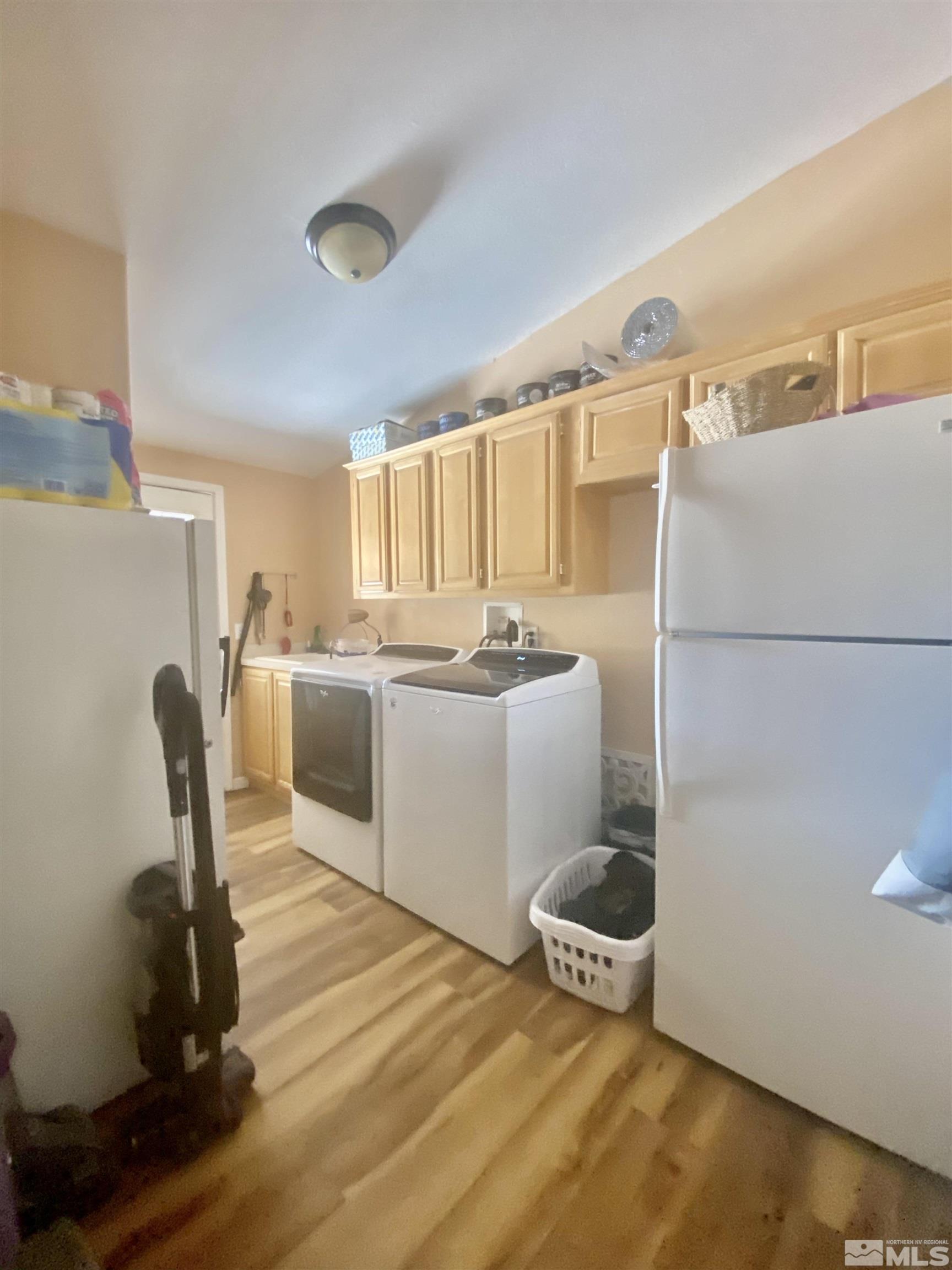 450 Reservoir Road Lovelock, NV 89419 - Photo 18 of 37 a kitchen with a refrigerator and a stove