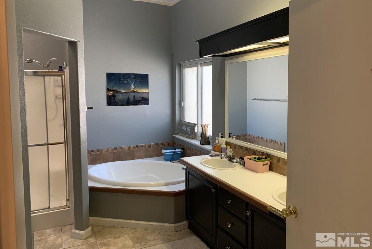 450 Reservoir Road Lovelock, NV 89419 - Photo 31 of 37 a bathroom with a sink and a mirror